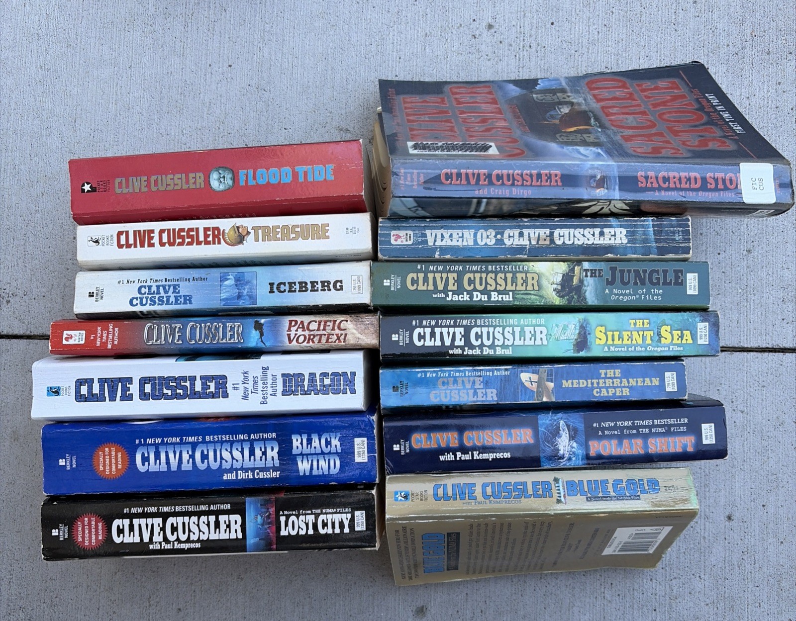 Mixed Lot of 14 Clive Cussler Paperback books Lost City Black Wind Blue Gold Etc