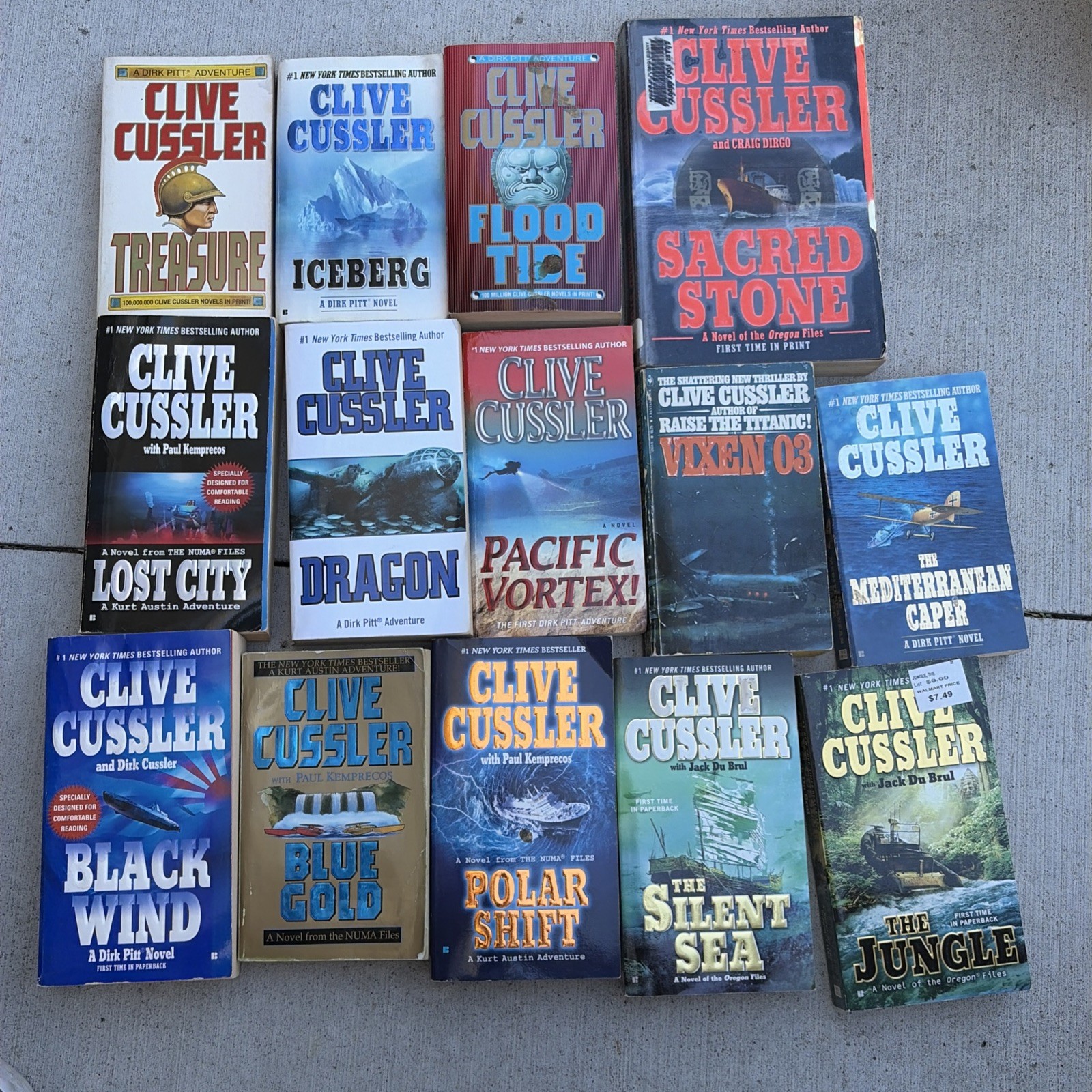 Mixed Lot of 14 Clive Cussler Paperback books Lost City Black Wind Blue Gold Etc